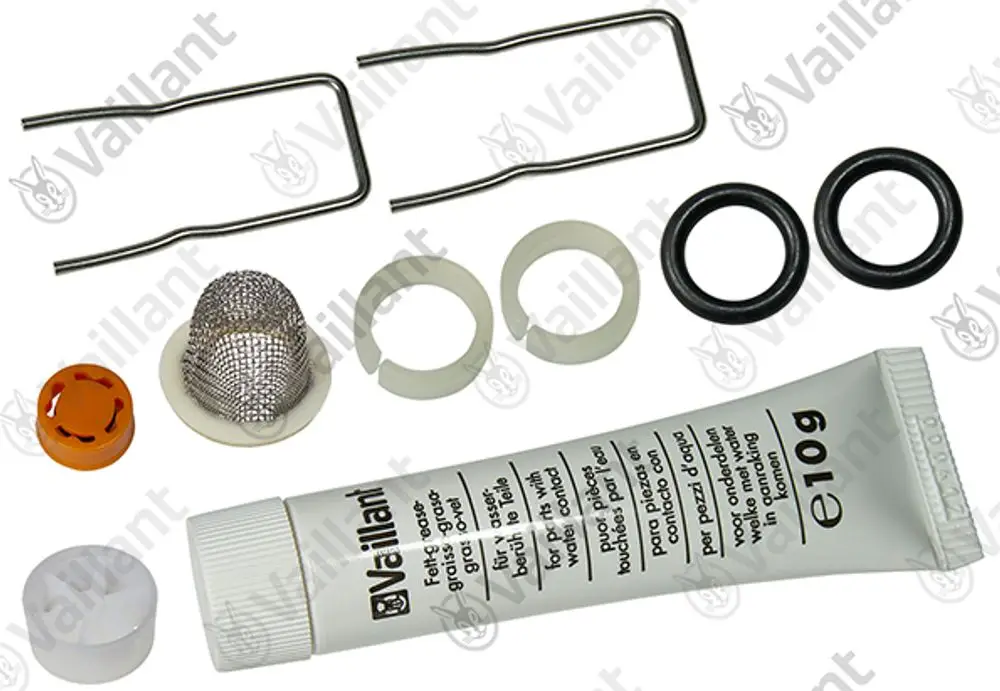 Vaillant Zubehörset mit verschiedenen Teilen, darunter eine Dichtung, ein Maschinenschutzgitter, zwei Federclips und eine Tube Dichtmasse.
